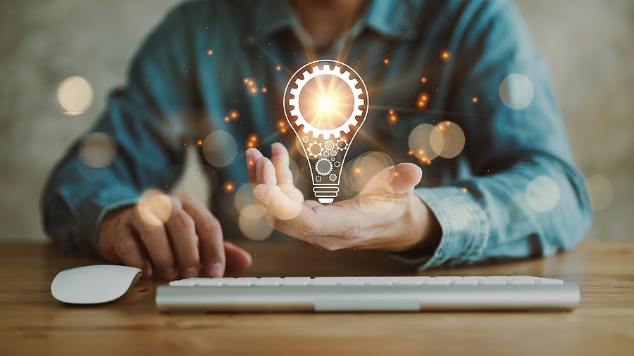 automotive executive search innovation with image of lightbulb and hand